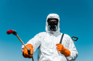 An ant exterminator preparing to spray